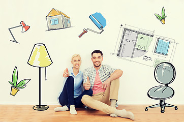 Image showing happy couple showing thumbs up at new home