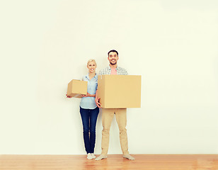 Image showing couple with cardboard boxes moving to new home