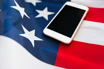 Image showing close up of smartphone on american flag