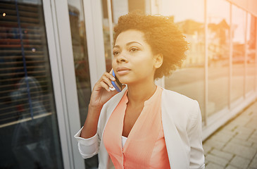 Image showing african businesswoman calling on smartphone