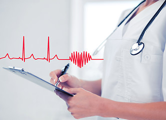 Image showing female doctor with stethoscope and prescription