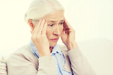 Image showing face of senior woman suffering from headache