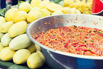 Image showing chilly wok or pilaf and mango at street market