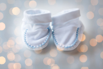 Image showing close up of white baby bootees for newborn boy