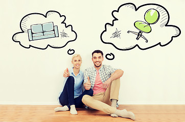 Image showing happy couple showing thumbs up at new home