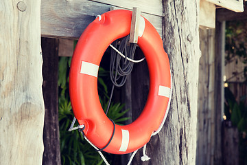 Image showing lifebuoy or life preserver hanging on rescue booth