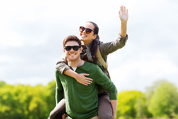 Image showing happy couple with backpacks having fun outdoors