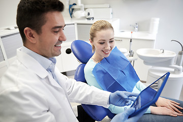 Image showing male dentist with tablet pc and woman patient