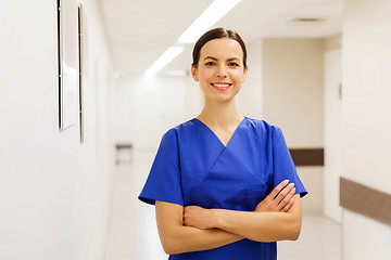 Image showing happy doctor or nurse at hospital corridor