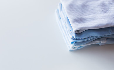 Image showing close up of baby boys clothes for newborn on table