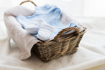 Image showing close up of baby clothes for newborn boy in basket