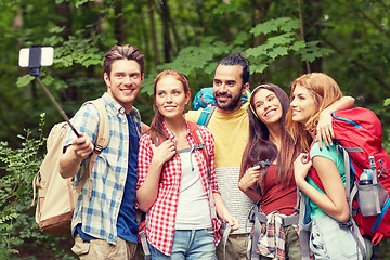Image showing friends with backpack taking selfie by smartphone