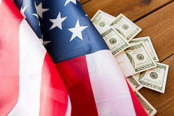 Image showing close up of american flag and dollar cash money