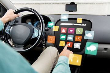 Image showing man driving car with menu icons on board computer