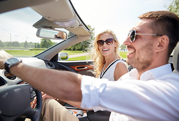 Image showing happy man and woman driving in cabriolet car