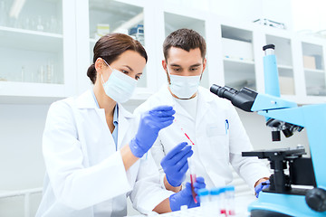 Image showing young scientists making test or research in lab