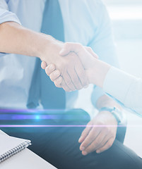 Image showing businessmen shaking hands in office