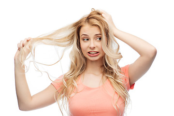 Image showing woman holding strand of her hair