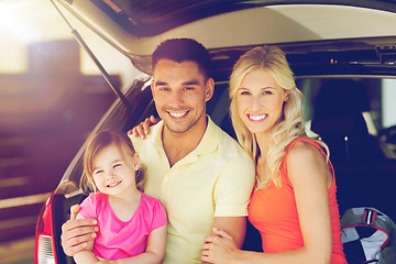 Image showing happy family with hatchback car at home parking