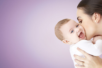 Image showing happy mother kissing adorable baby