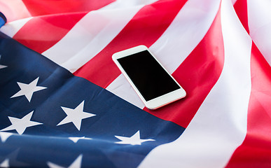 Image showing close up of smartphone on american flag