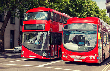 Image showing city street with red double decker buses in london