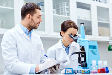 Image showing young scientists making test or research in lab