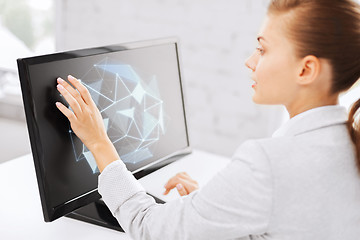 Image showing businesswoman with projection on computer