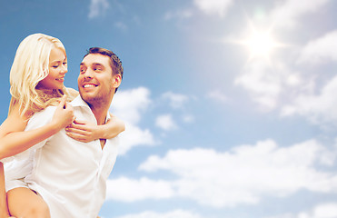 Image showing happy couple having fun over blue sky background