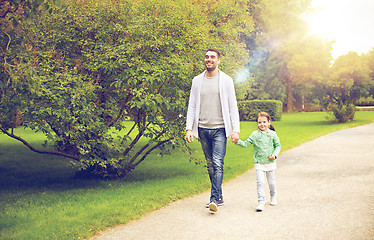 Image showing happy family walking in summer park