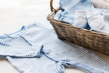 Image showing close up of baby clothes for newborn boy in basket