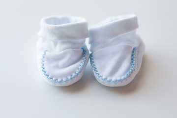 Image showing close up of white baby bootees for newborn boy