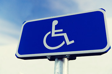 Image showing close up of road sign for disabled outdoors