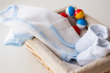 Image showing close up of baby clothes for newborn boy in basket