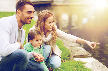 Image showing happy family walking in summer park