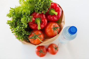 Image showing basket of fresh vegetables and water at kitchen