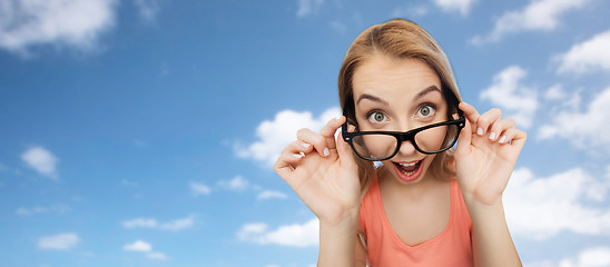 Image showing happy young woman or teenage girl in eyeglasses