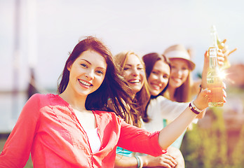 Image showing girls with drinks on the beach