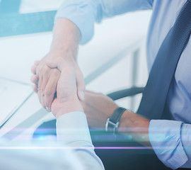 Image showing businessmen shaking hands in office