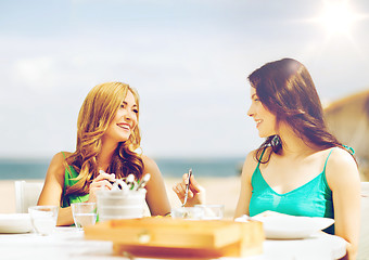 Image showing girls in cafe on the beach