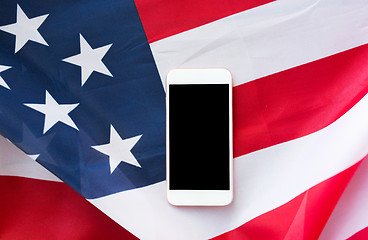 Image showing close up of smartphone on american flag