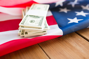 Image showing close up of american flag and dollar cash money