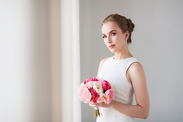 Image showing bride or woman in white dress with flower bunch