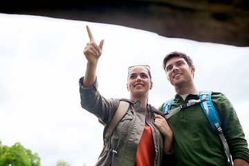 Image showing smiling couple with backpacks hiking