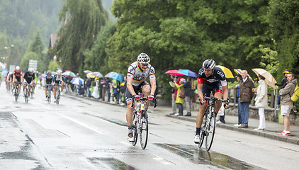 Image showing Two Cyclists Riding in the Rain - Tour de France 2014