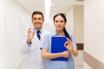 Image showing doctor and nurse showing ok sign at hospital