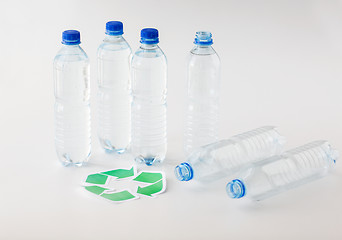 Image showing close up of plastic bottles and recycling symbol