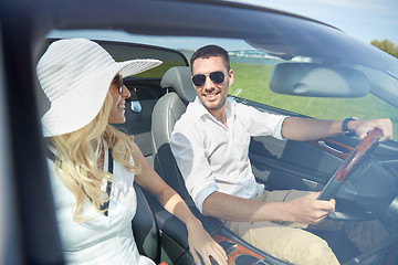 Image showing happy man and woman driving in cabriolet car