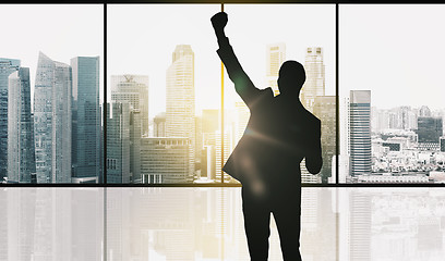 Image showing silhouette of business man over office background