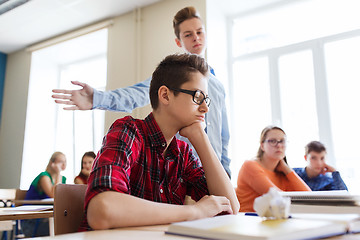 Image showing classmate offending student boy at school